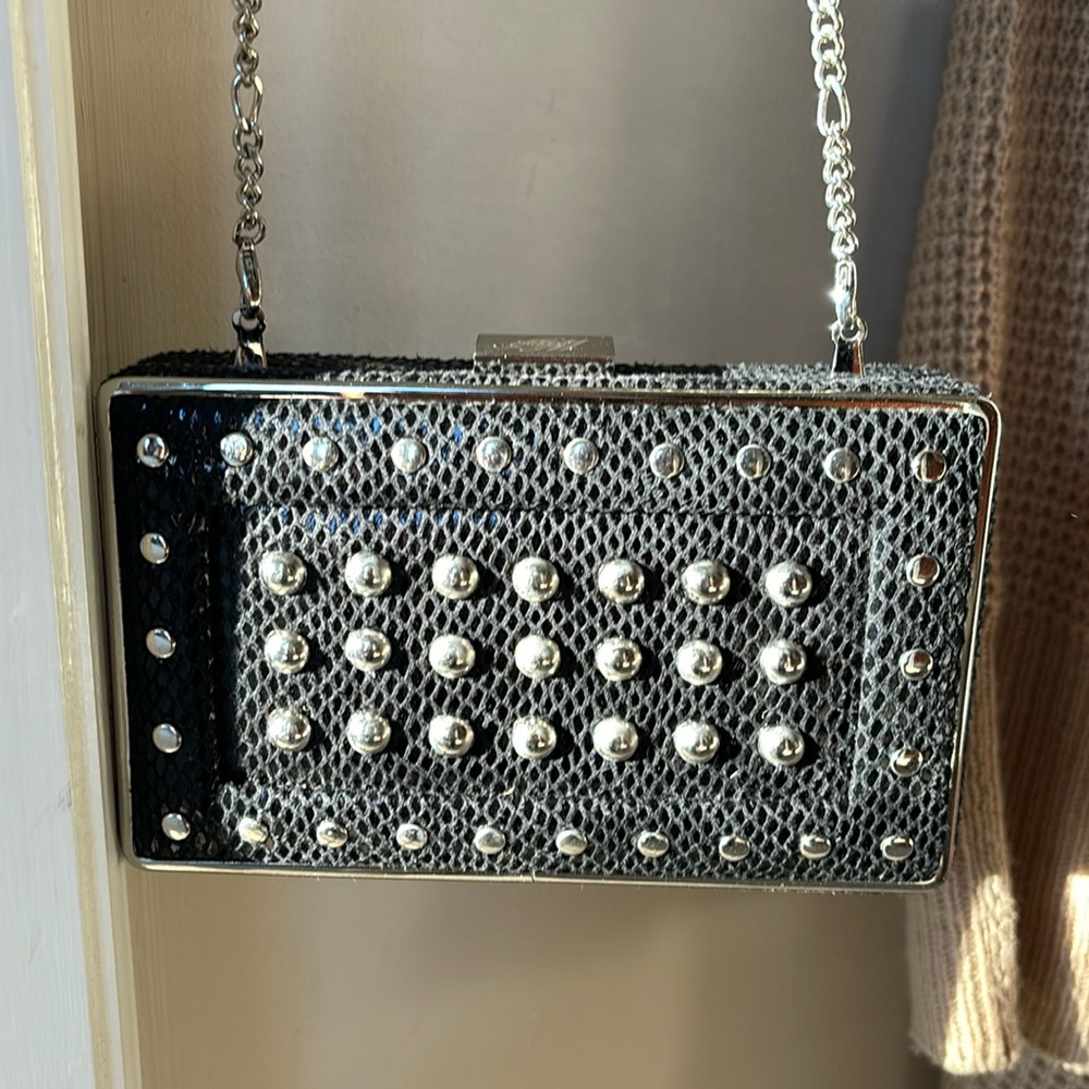 White House Black market studded clutch with optional chain.